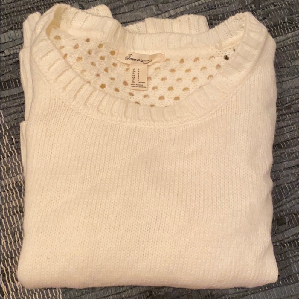 Off-white colored sweater.